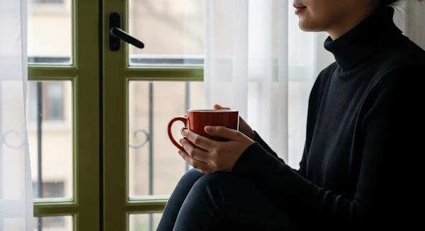 Person by Window with Mug