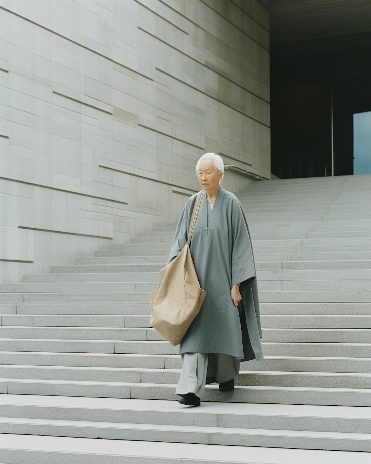 Elder in Contemplation on Stairs