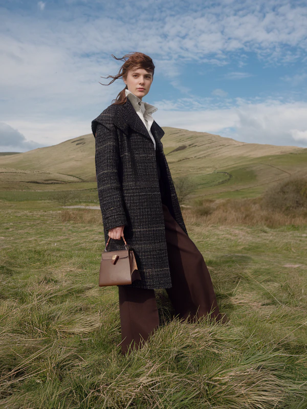 Woman in Grassy Field