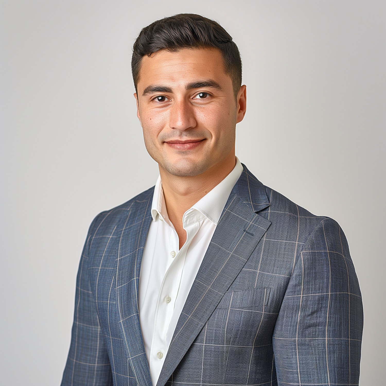 Confident Businessman in Blue Plaid Suit