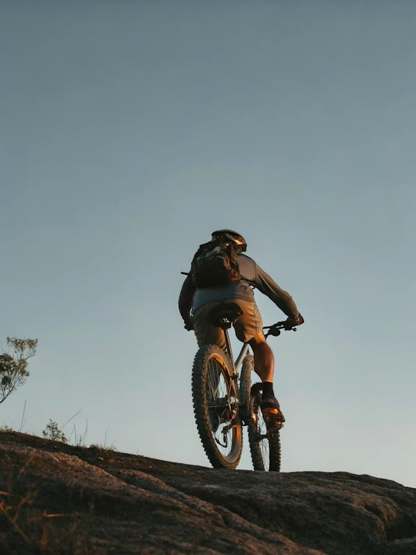 Cyclist on Rocky Terrain