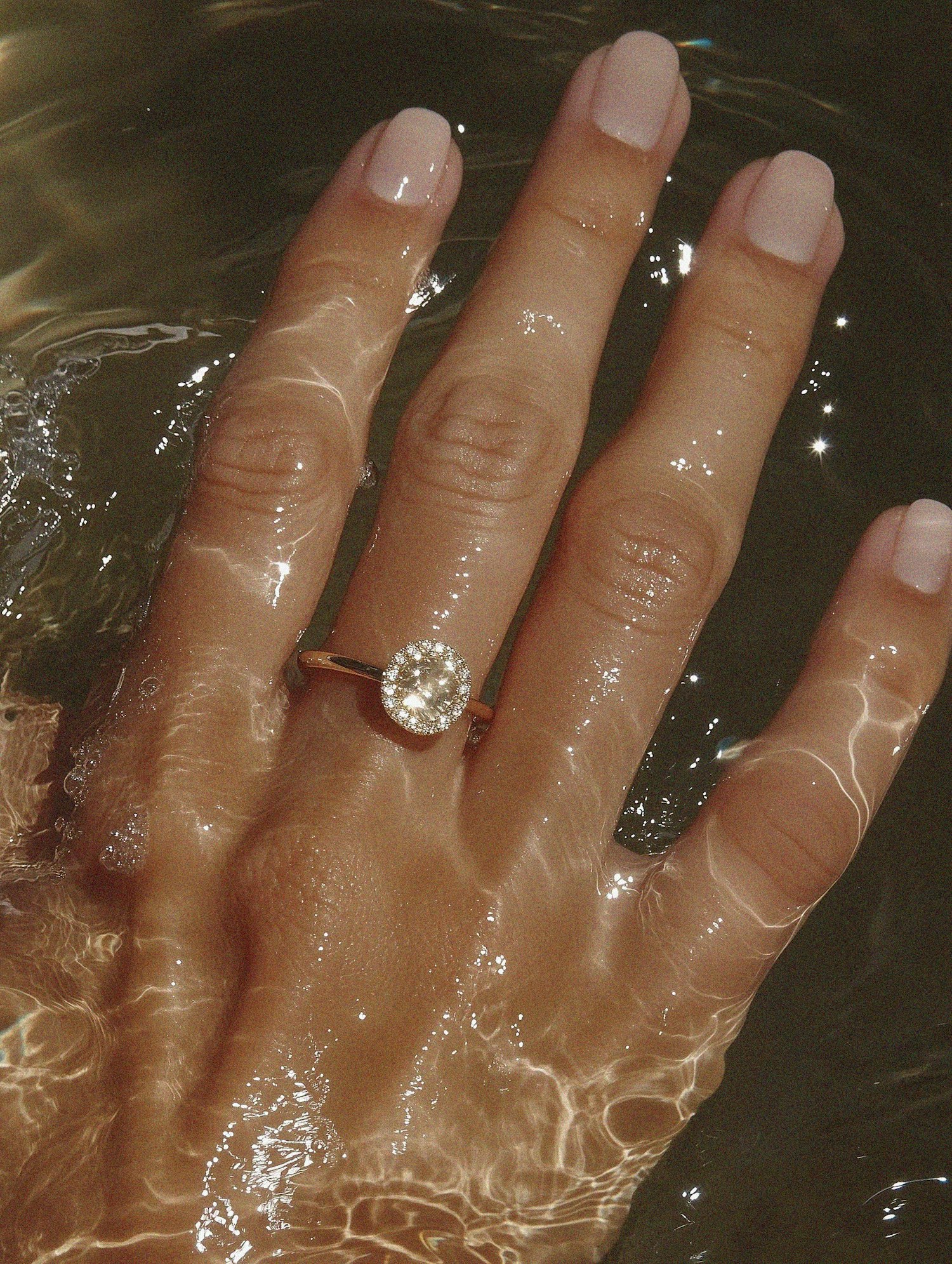 Hand in Water with Gemstone Ring