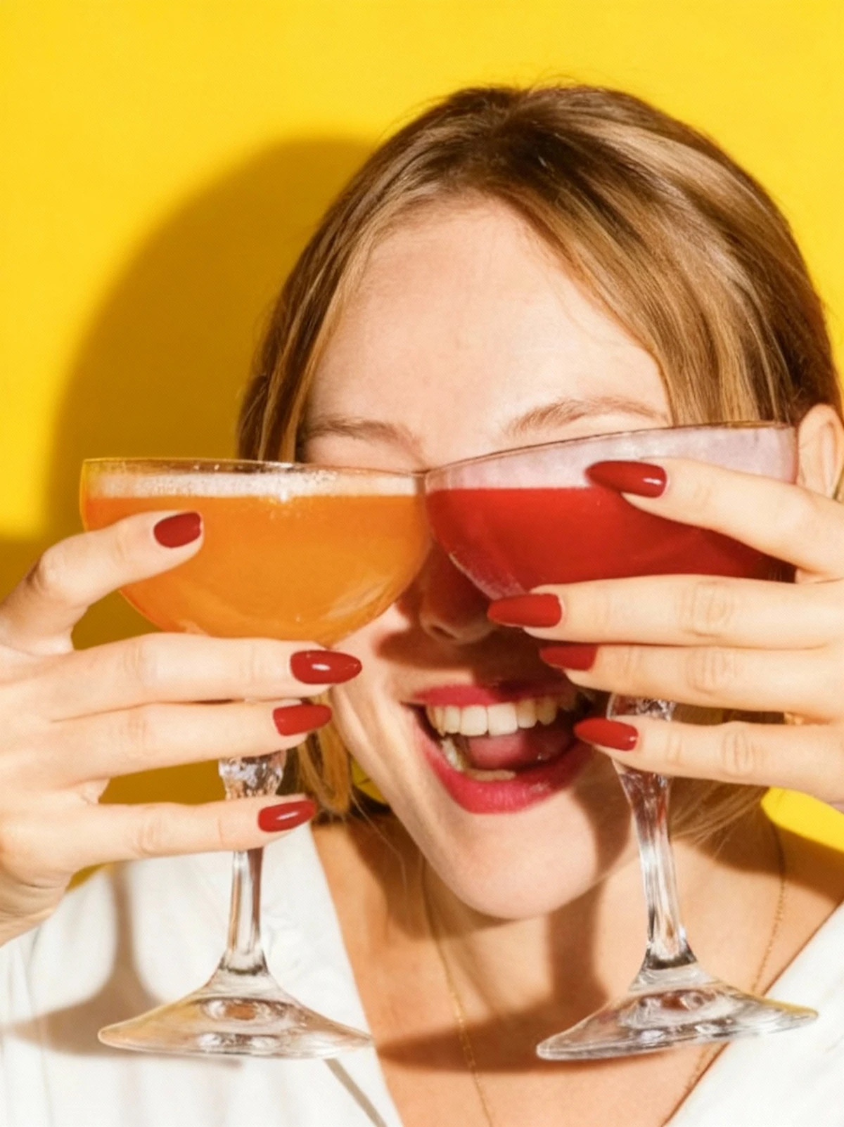 Guests raising cocktail glasses at an event