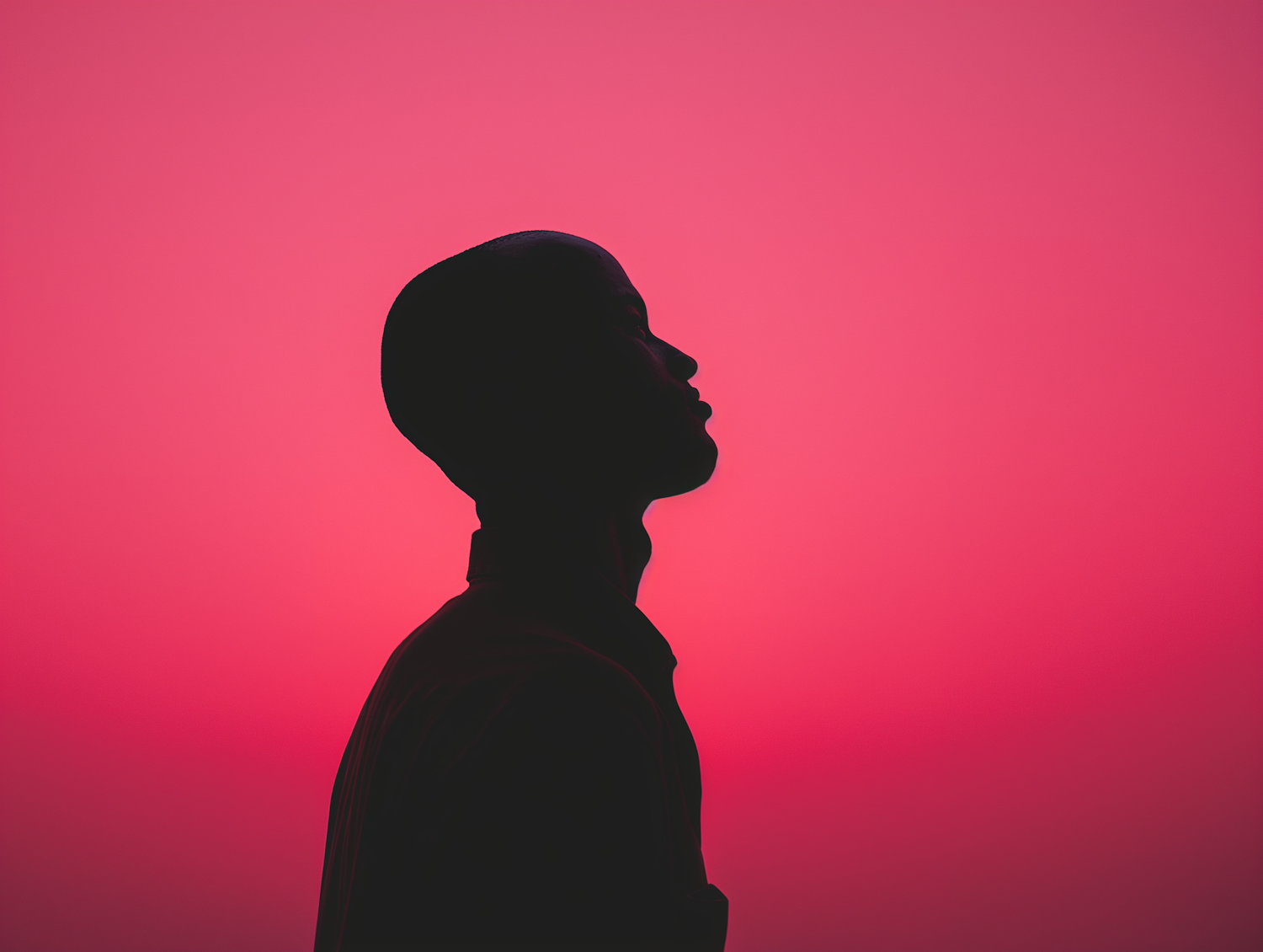 Contemplative Silhouette in Vibrant Pink