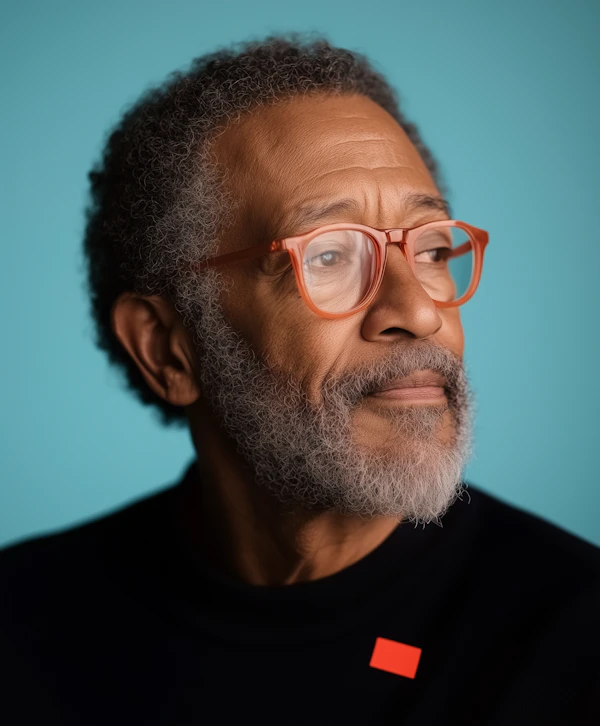 Thoughtful Older Man with Orange Glasses