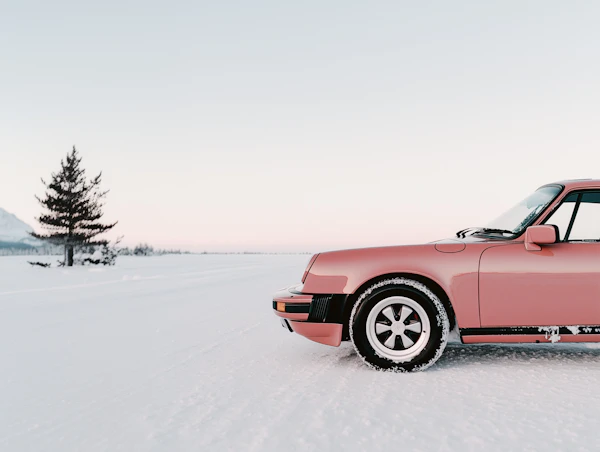 Vintage Car in Snowy Landscape