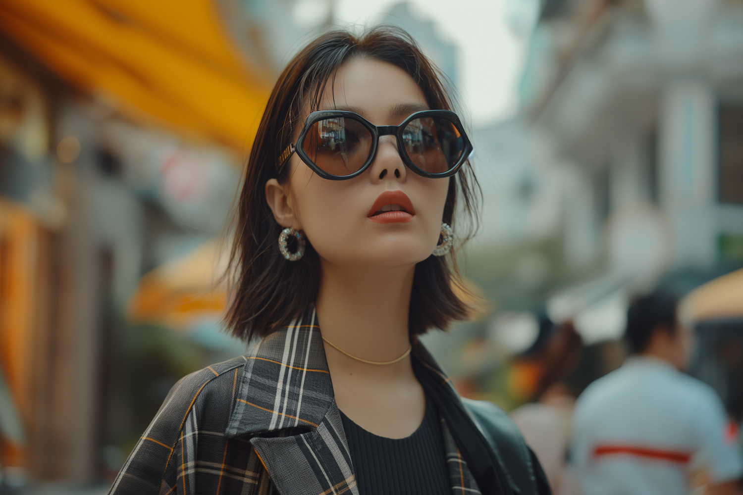 Young Woman with Sunglasses and Plaid Blazer