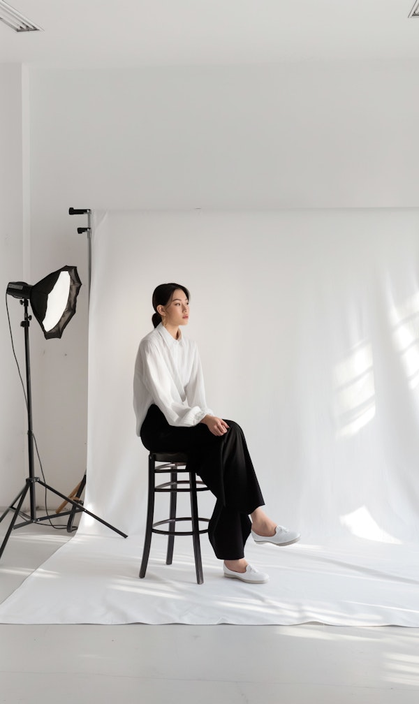 Elegant Woman in Photography Studio