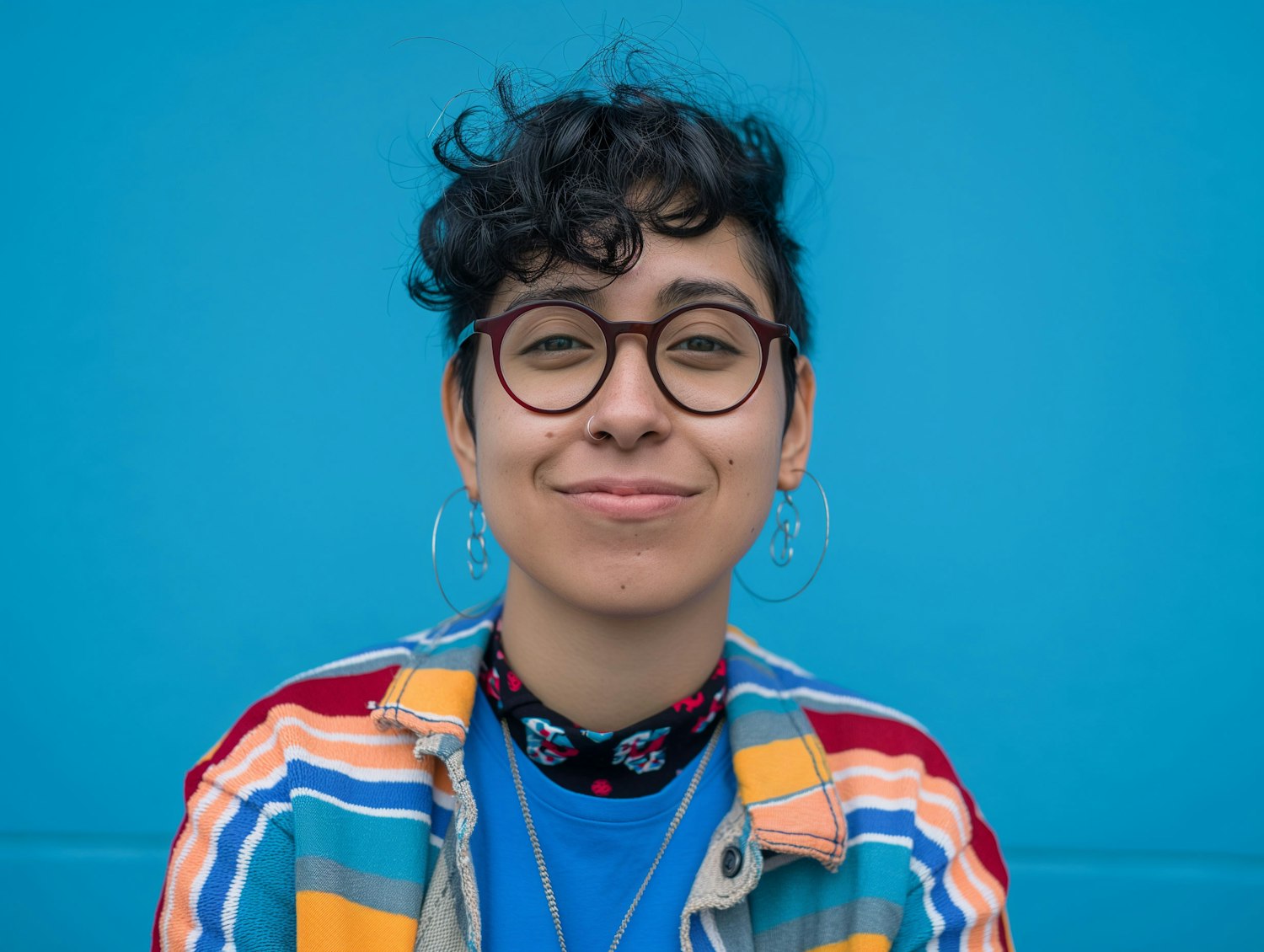 Joyful Young Adult in Striped Jacket