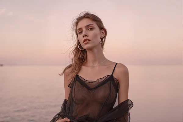 Woman by the Sea at Sunset