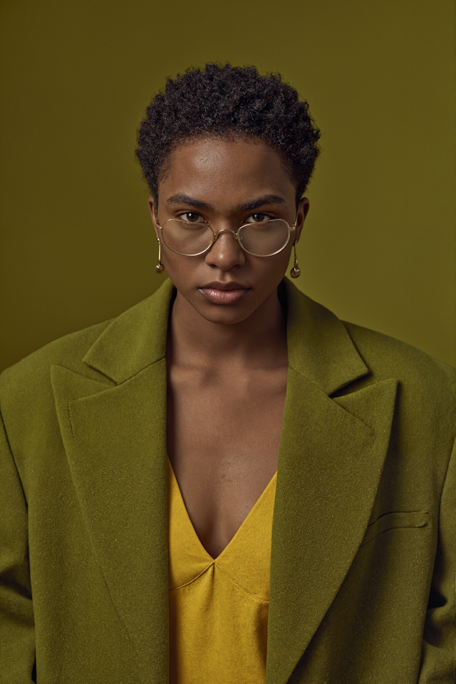 Portrait of a Person with Curly Hair and Glasses