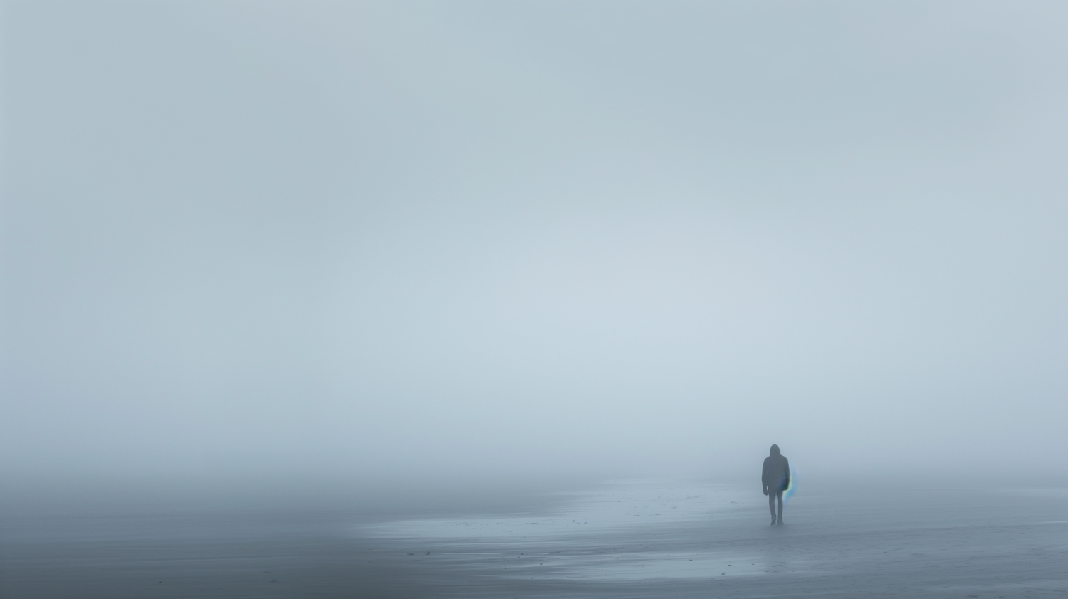 Solitary Figure on a Foggy Beach