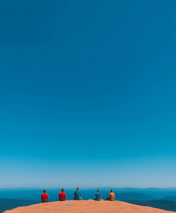 Contemplative Gathering on Rocky Outcrop