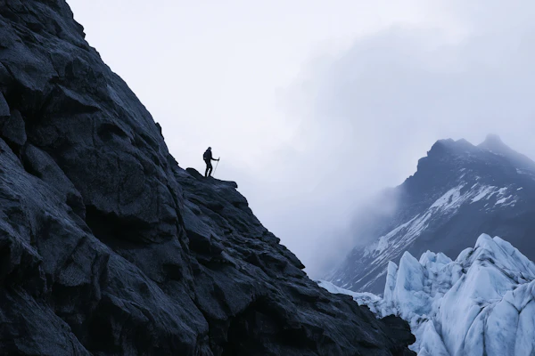 Lone Hiker in Rugged Landscape