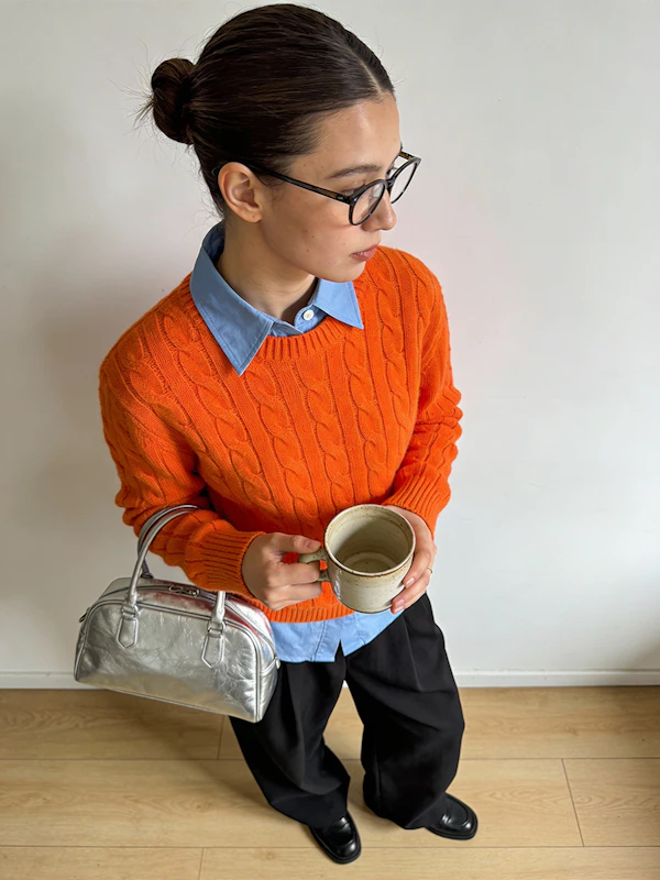 Person in Orange Sweater