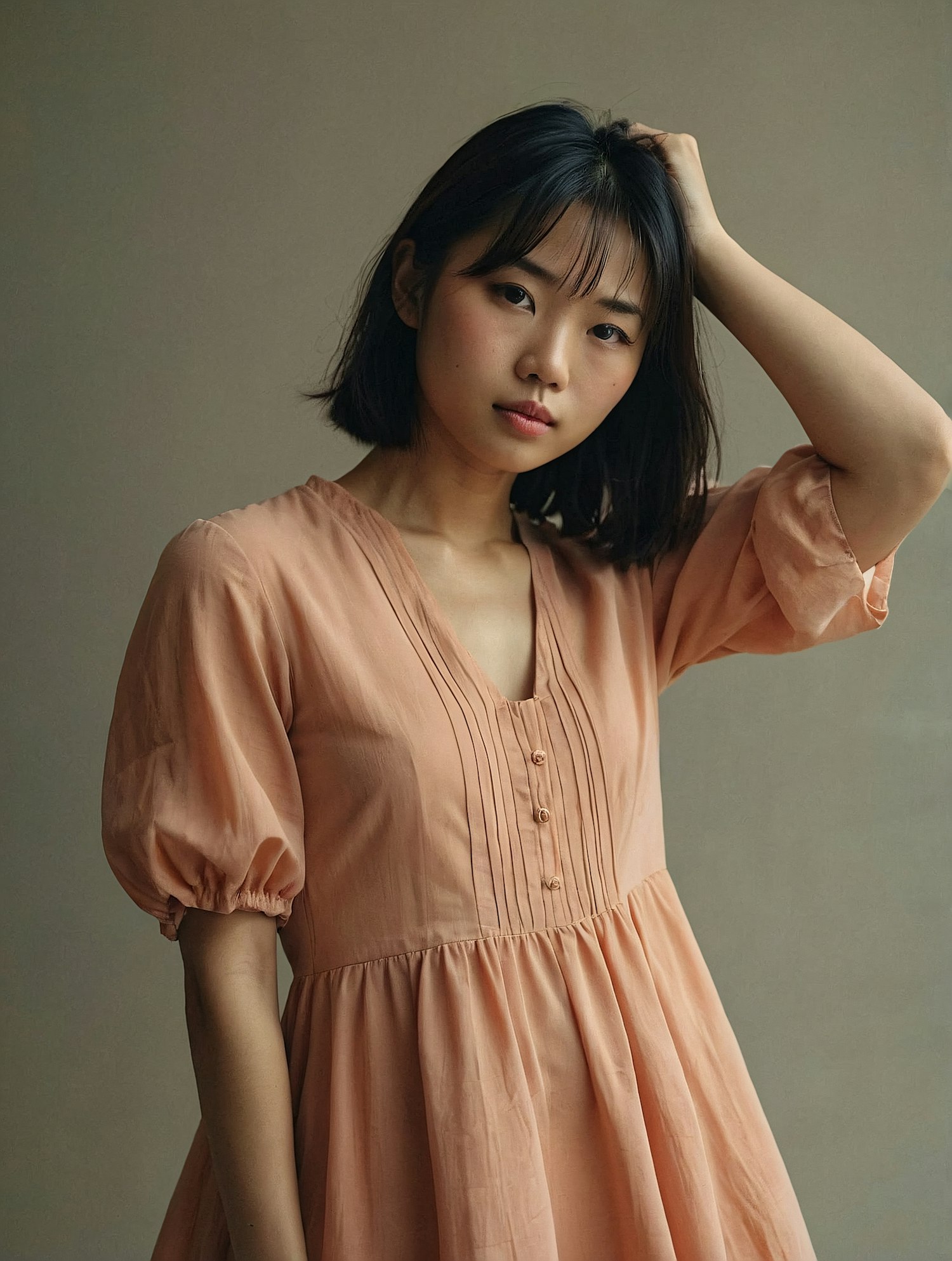 Introspective Woman in Peach Dress