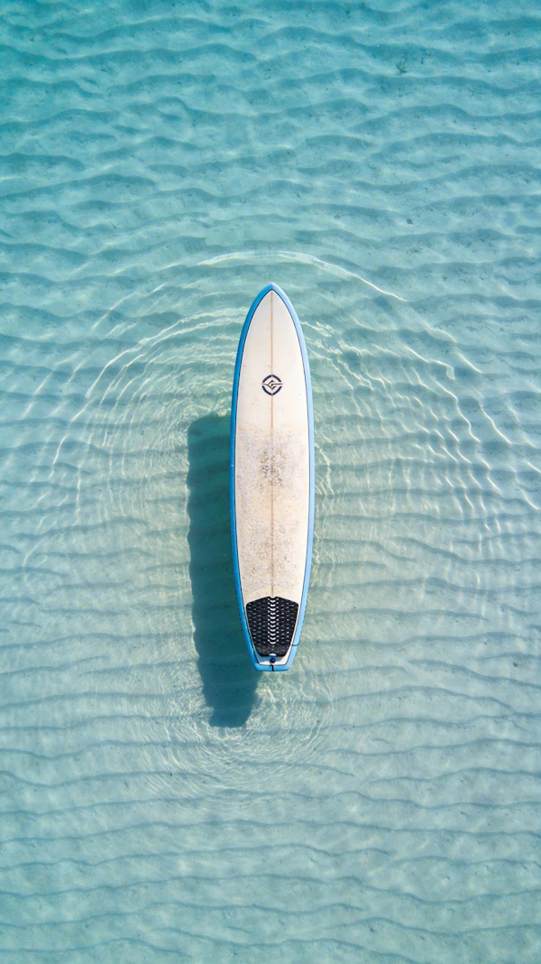 Surfboard on Clear Water