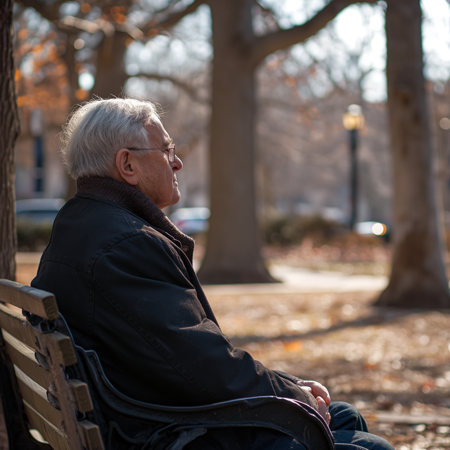 Contemplative Elderly Man in Autumn Park