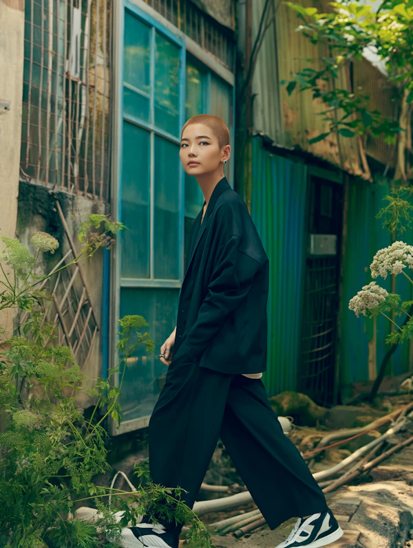 Confident Woman in Urban Garden