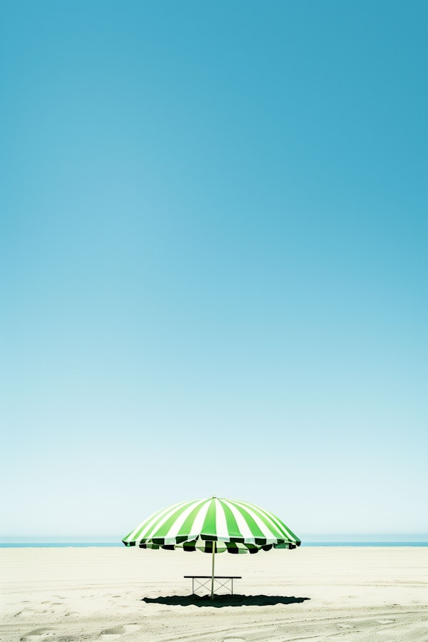 Solitary Striped Umbrella on Tranquil Beach