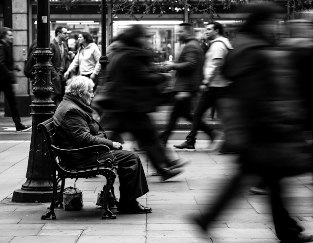 Contemplative Elderly Man in Urban Setting