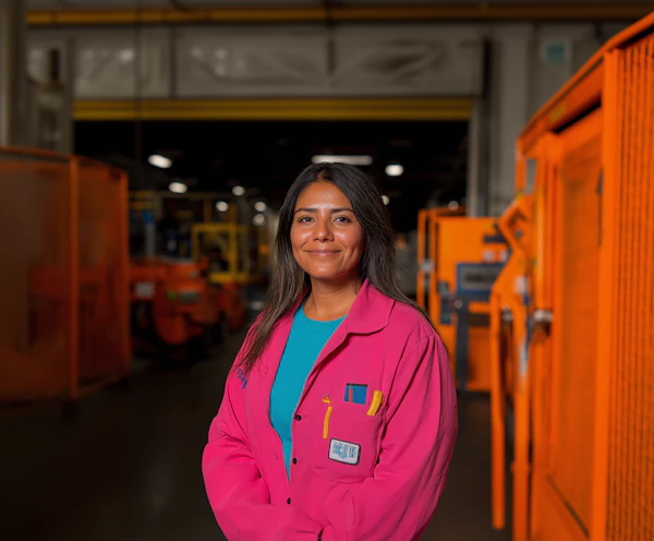 Confident Woman in Industrial Setting