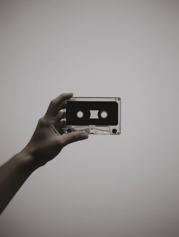 Hand Holding Cassette