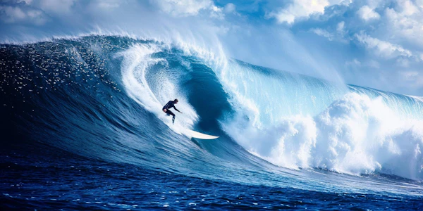 Surfer Riding a Massive Wave