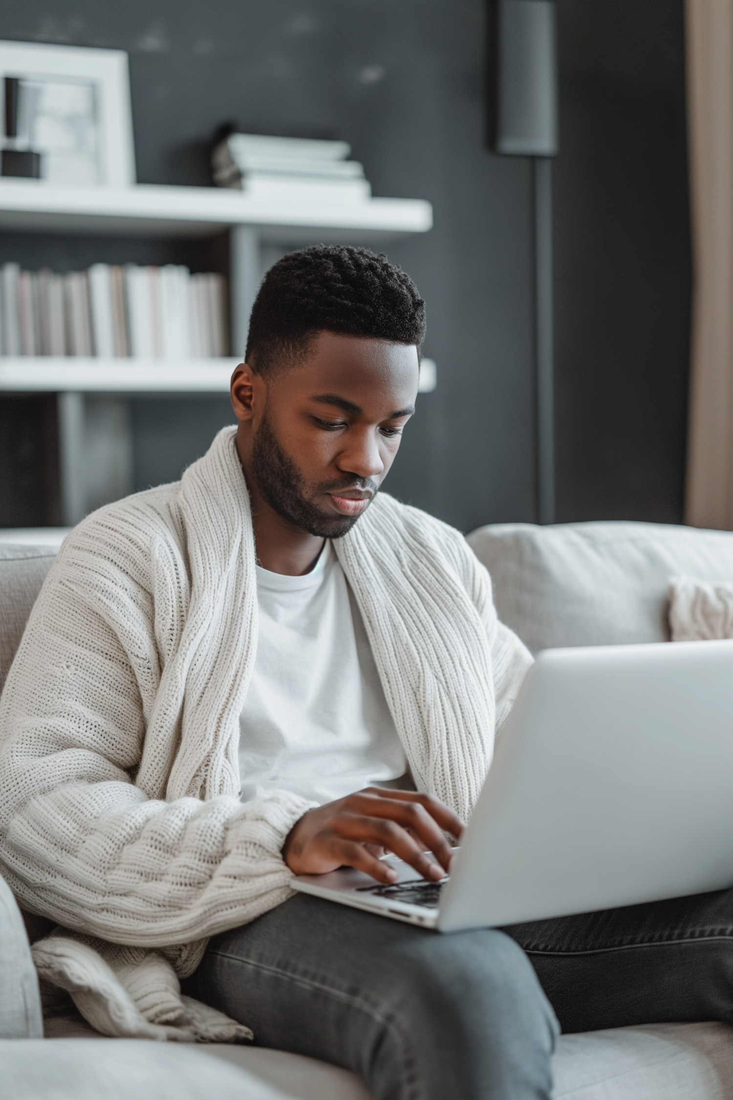 Modern Comfort: A Man Focused on Work at Home