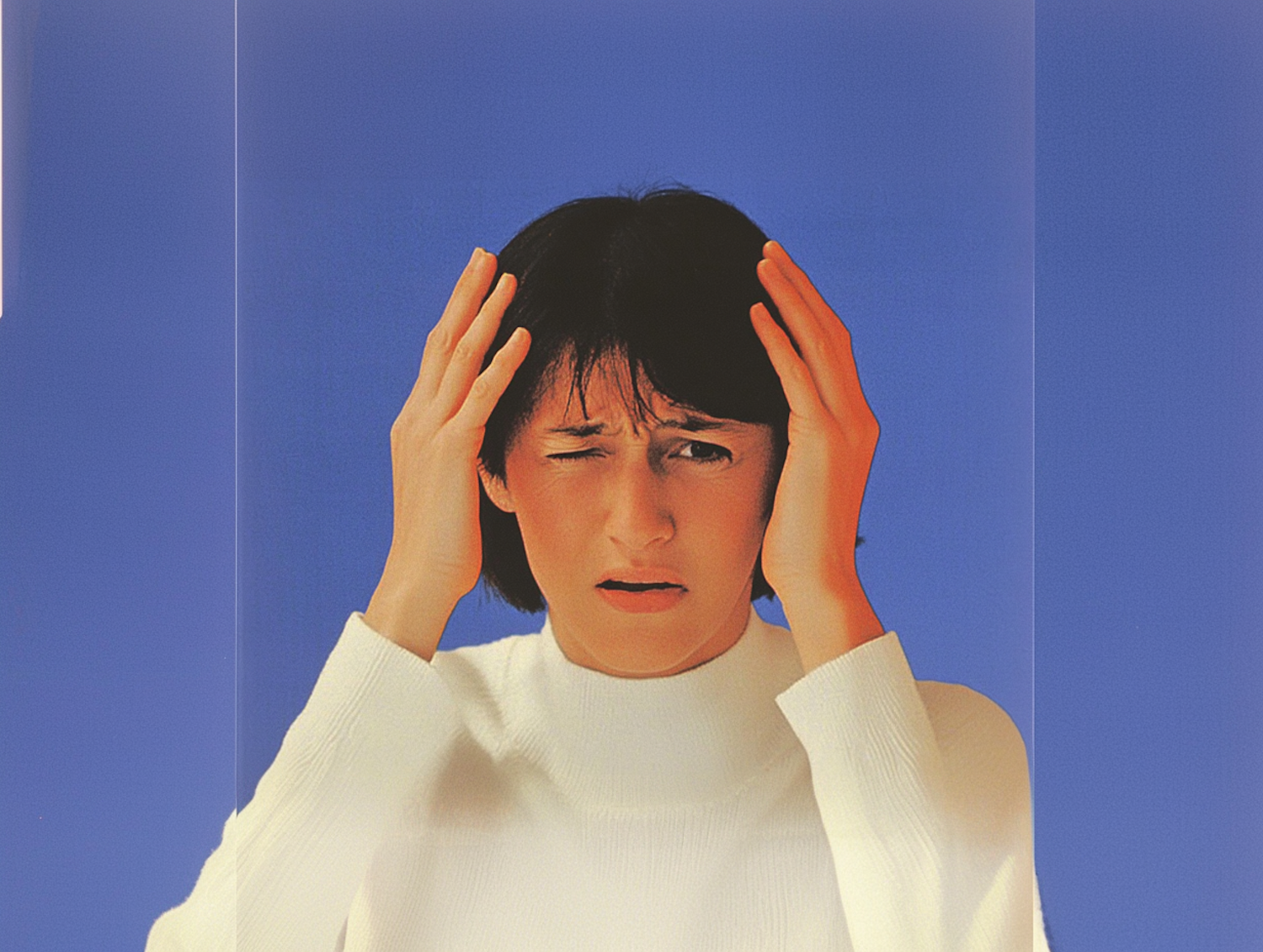 Person in White Turtleneck with Stressful Expression