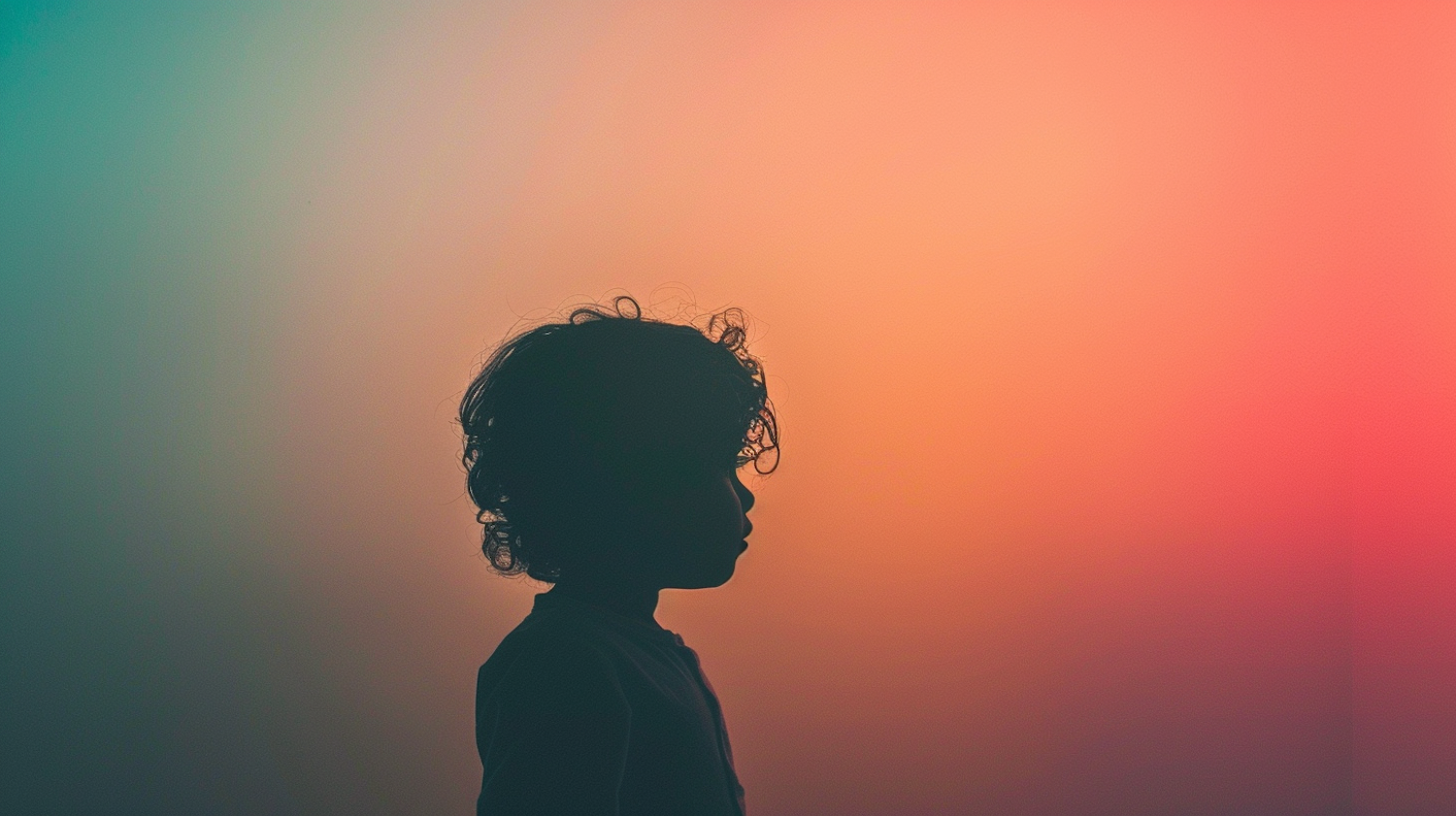 Child's Silhouette Against Gradient Background