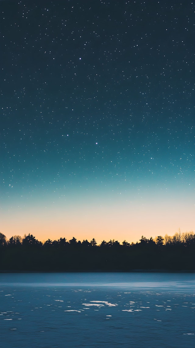 Serene Night Sky Over Frozen Landscape