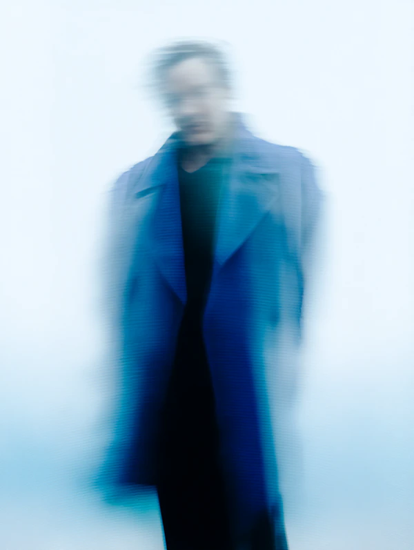 Blurred Figure in Blue