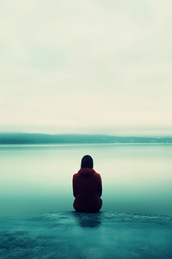 Solitary Figure by the Water