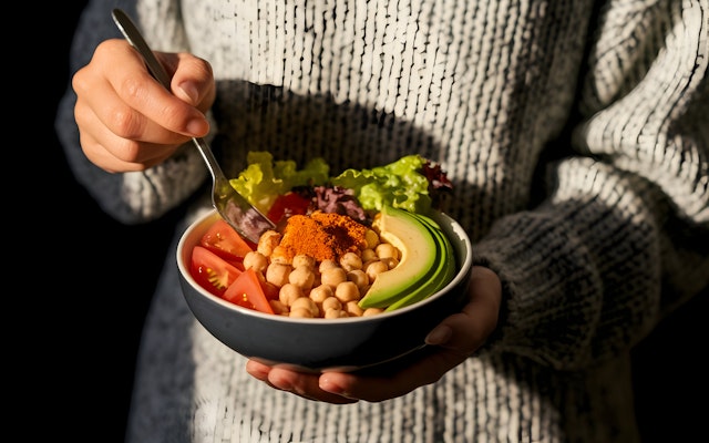 Person Holding Salad Bowl