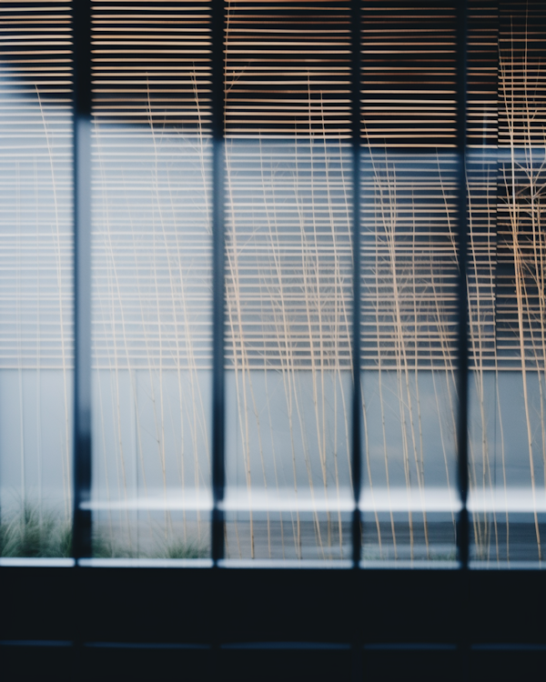 Warm Serenity: A Study in Light and Texture Through Vertical Blinds