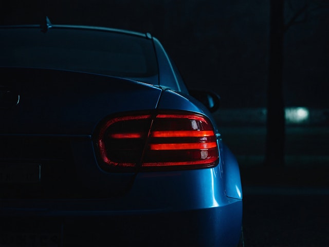 Blue Car with Illuminated Taillights