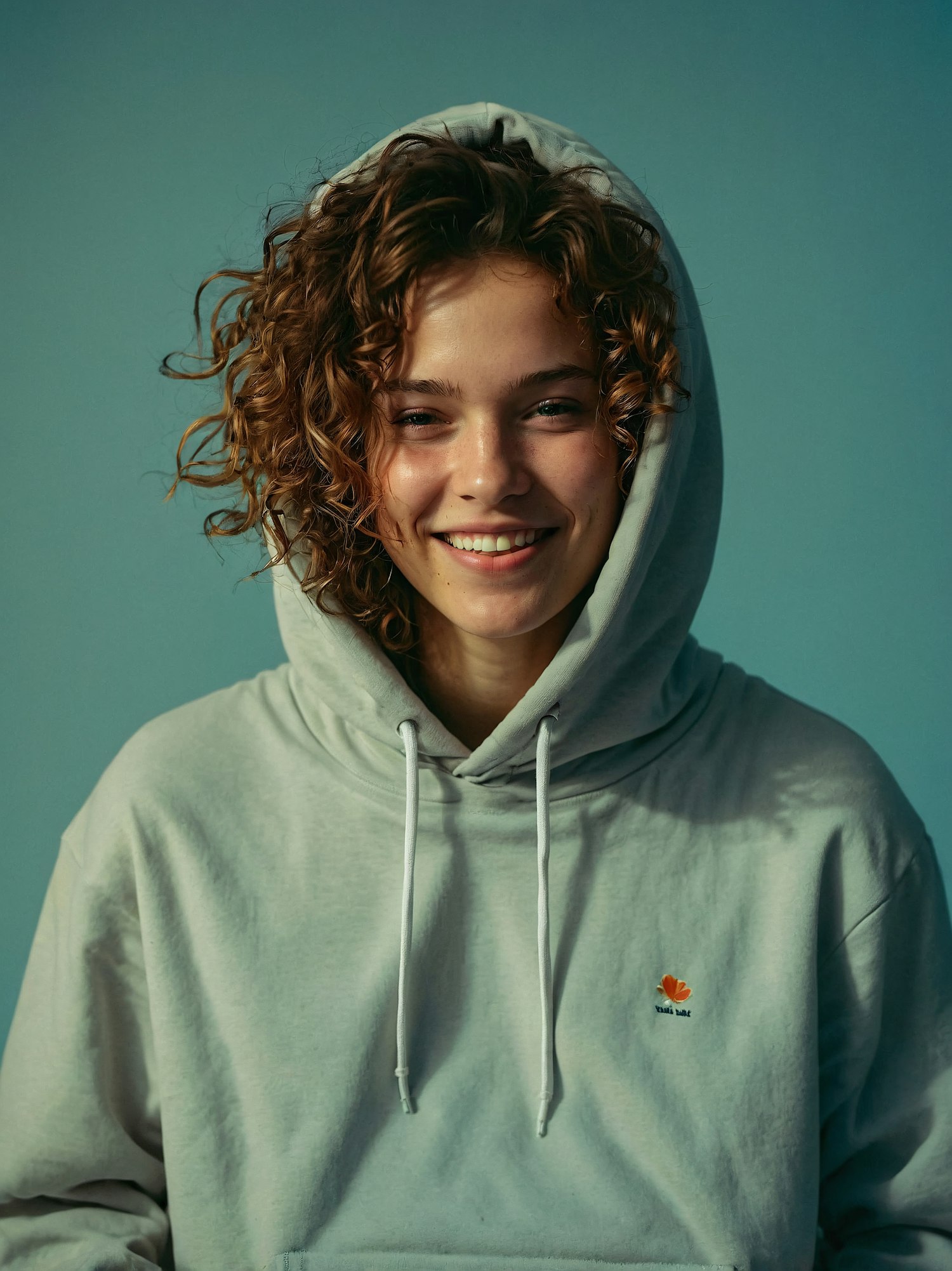 Smiling Person in Hoodie