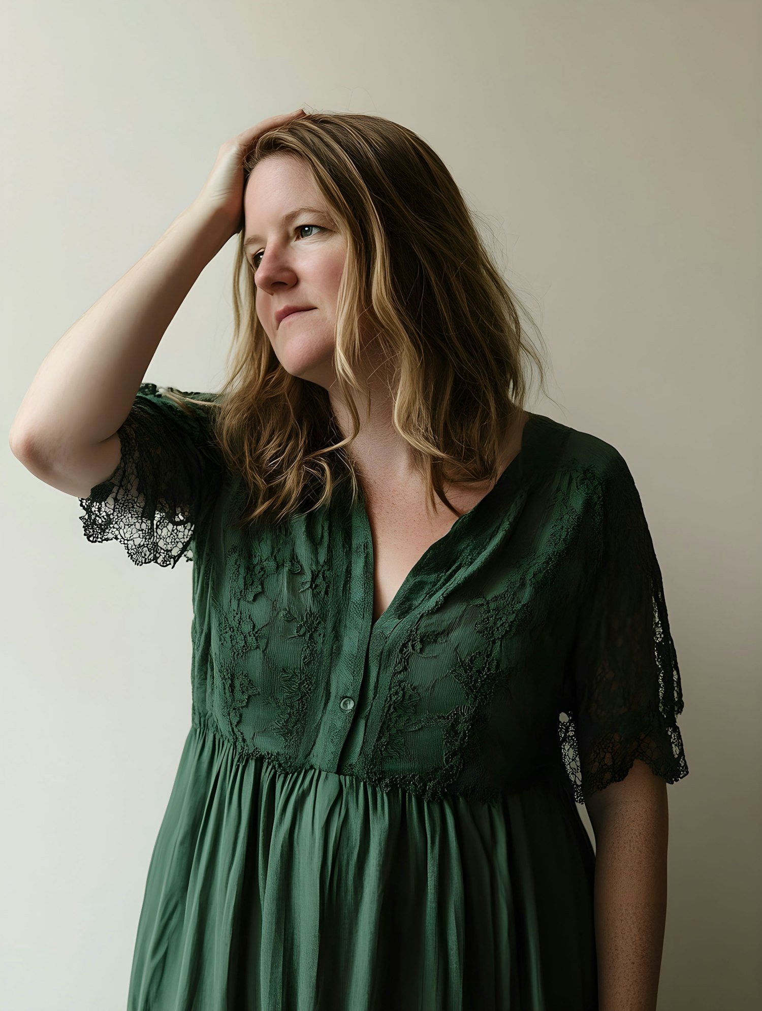 Contemplative Woman in Green Dress