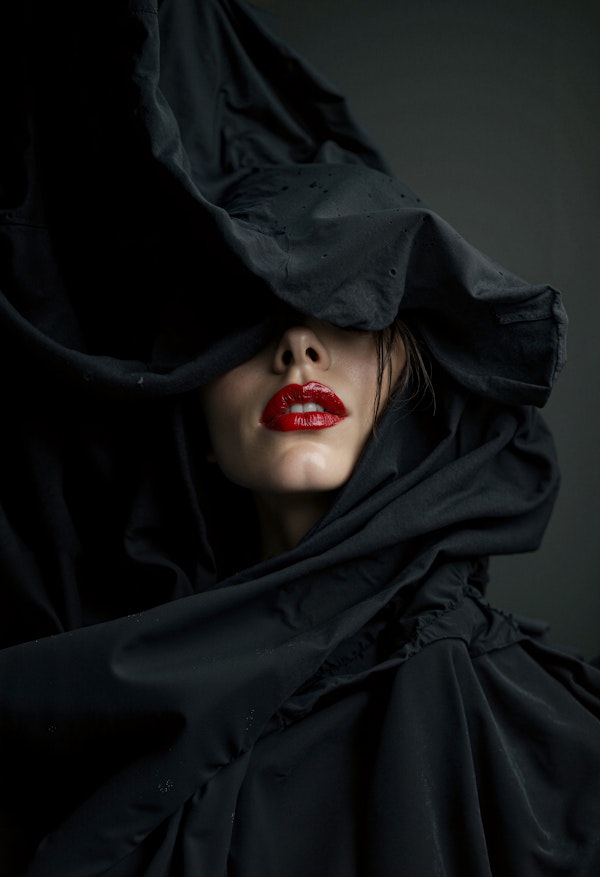 Enigmatic Woman with Red Lipstick