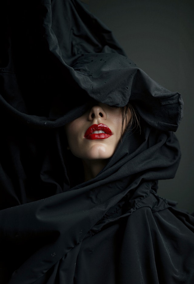 Enigmatic Woman with Red Lipstick