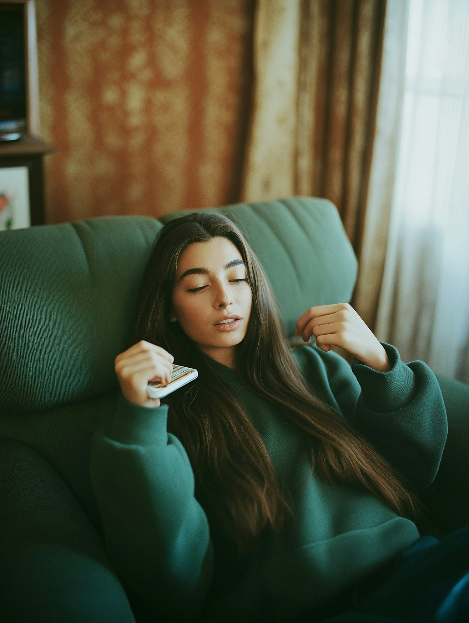 Serene Woman on Green Sofa