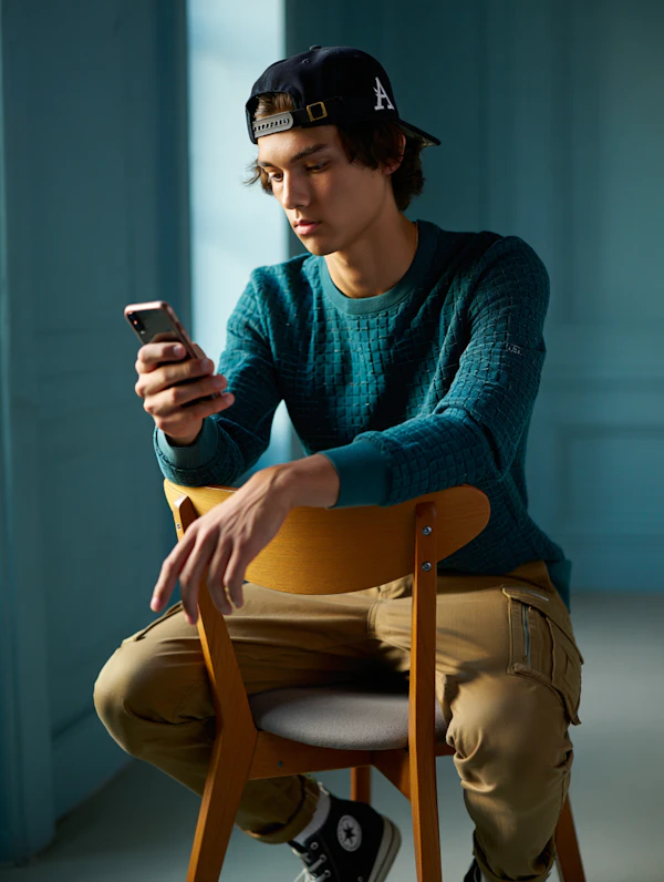 Man Relaxing with Phone