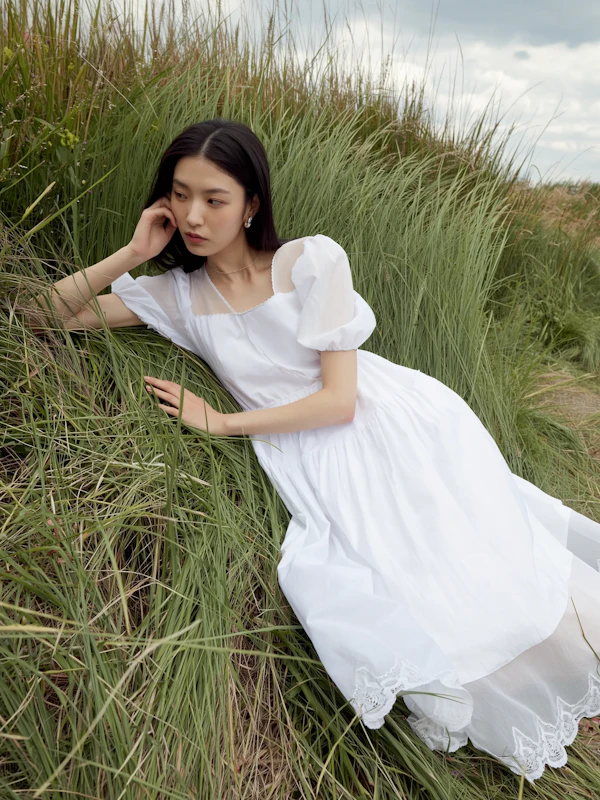 Woman in Grassy Field
