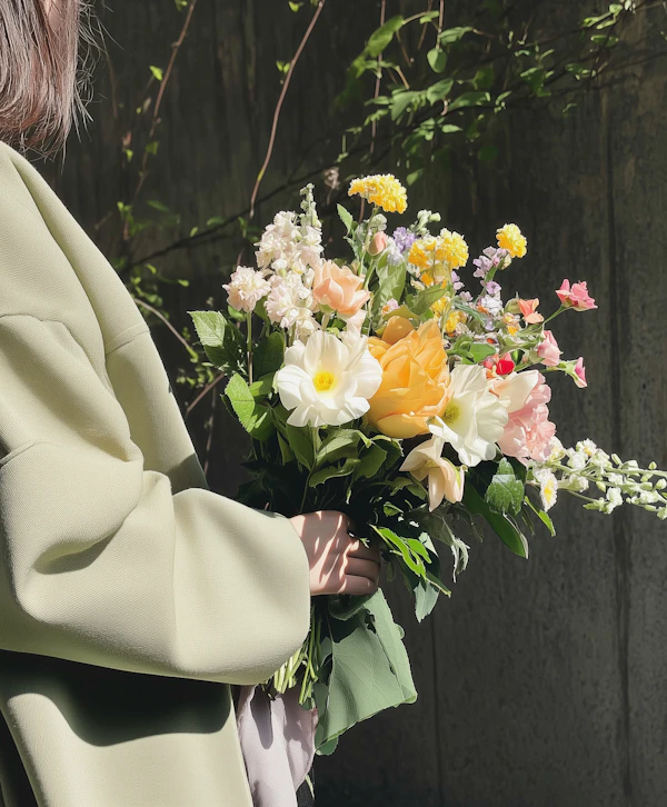 Person Holding Flowers
