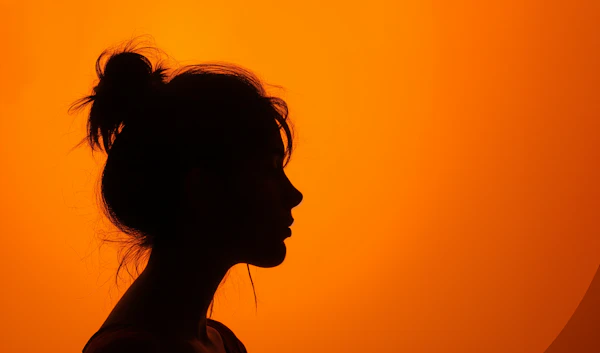 Contemplative Silhouette Against Sunset