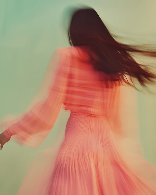 Dynamic Motion in Coral Dress