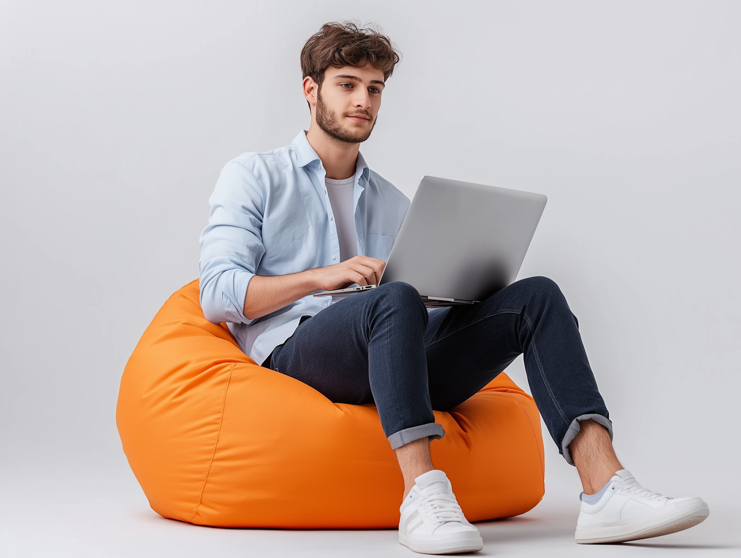 Young Man on Bean Bag with Laptop