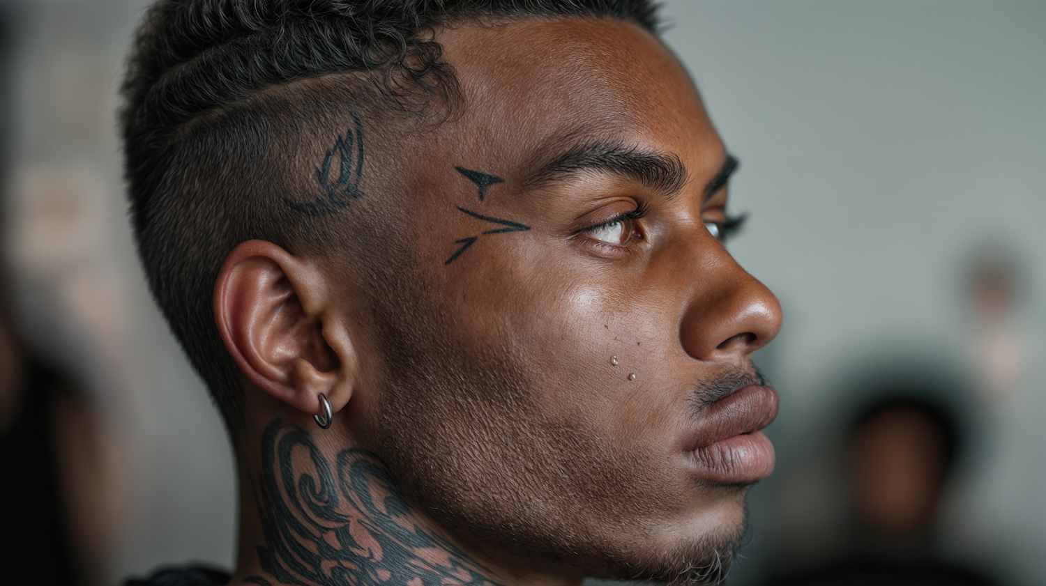 Contemplative Man with Facial Tattoos