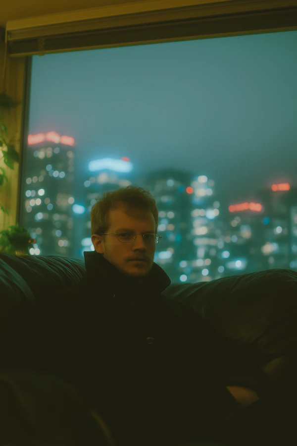 Man on Leather Couch